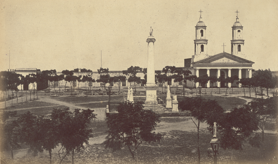 160041_6__vista_de_la_plaza_25_de_mayo_casa_municipal_parroquial_e_iglesia_matriz_columnna_a_la_constitucion_construida_1855_1866.png